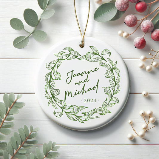 ceramic green leafy ornament, personalized text in the middle